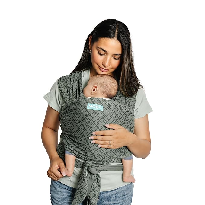 Mother wearing Moby baby carrier wrap